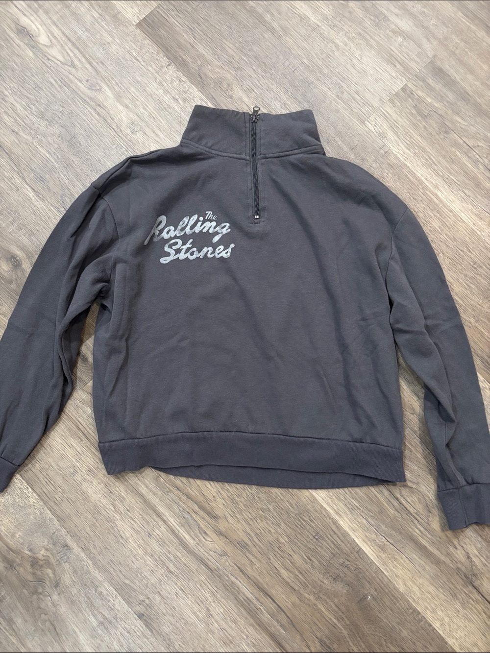 the Rolling Stones Black Half-Zip Pullover with Gray Script